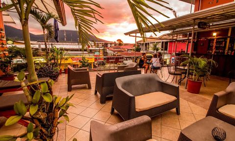 Hotel Las Colinas terrace lounge at sunset.