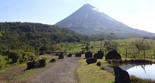 Arenal Volcano Tour Image: Arenal Volcano as seen down the trail of the Arenal Volcano History Walk.