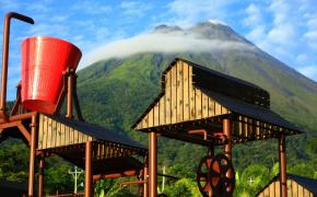 Arenal Water Activities Image: A playful, oversized red bucket at Kalambu Hot Springs Water Park.