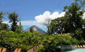 Arenal Hot Springs Image: Steaming Arenal Volcano rises in the background of Tabacón Hot Springs.